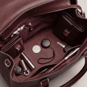 BeSafeTag GPS tracker inside an elderly woman's handbag